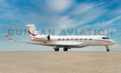 Newly painted Gulfstream 650 in white with sleek red striping by Duncan Aviation