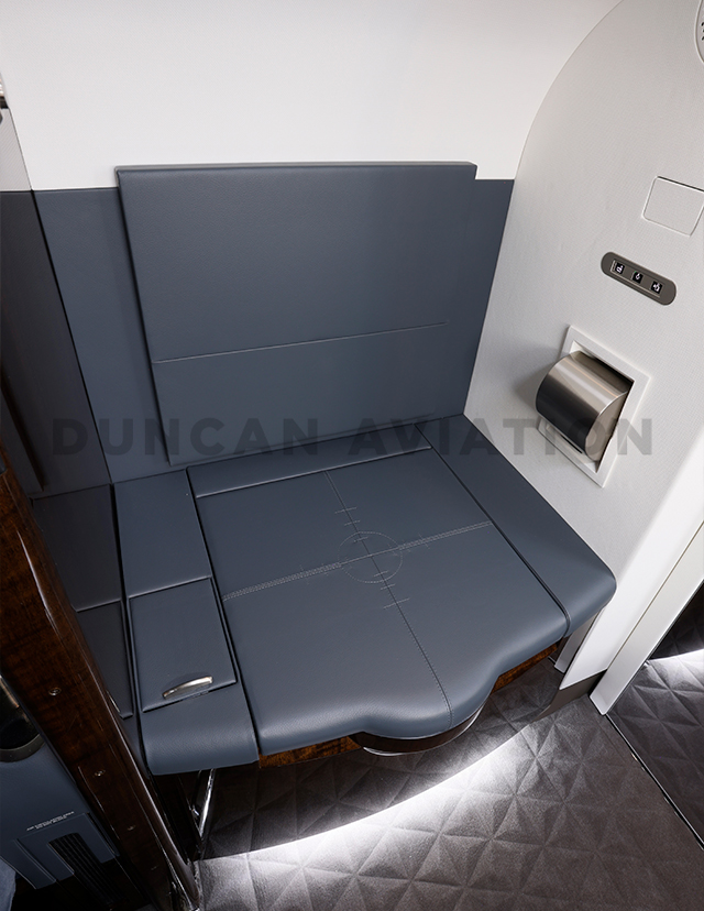 Dark blue upholstery on crew seat in Falcon 900