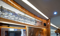 Refurbished galley with warm wood tones in Global Express