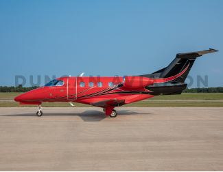 Exterior of Phenom 100 with hot red and black paint