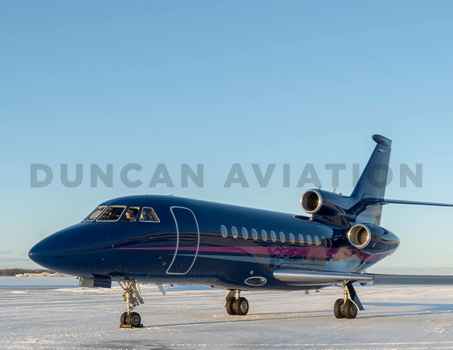 Falcon 900 Exterior with navy paint and light blue and magenta stripe