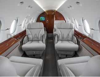 Updated interior of Hawker 800 in cool gray and warm wood tones