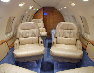 Cozy and warm interior of Hawker 800 with blue carpet accent