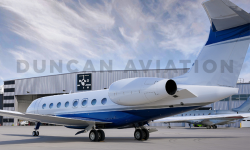 Exterior photo from the rear of aircraft of new paint on a Gulfstream 650 with Duncan Aviation hangar in background