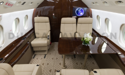 Falcon 2000 with refurbished interior in shades of rich brown wood and light tan leather