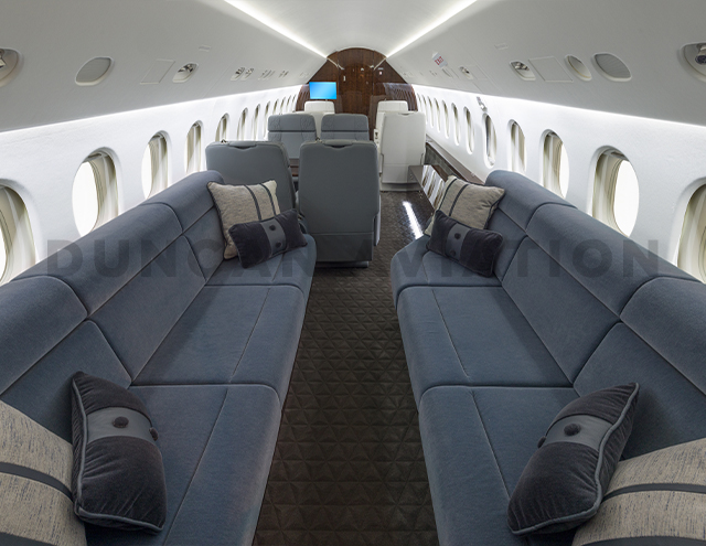 Blue velvet upholstery on facing divans in Falcon 900