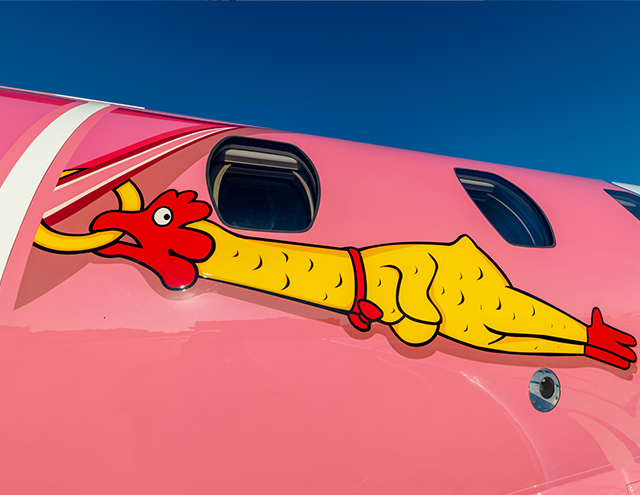 Ripley's Believe It or Not! Flying Pig Citation by Duncan Aviation featuring a rubber chicken earring
