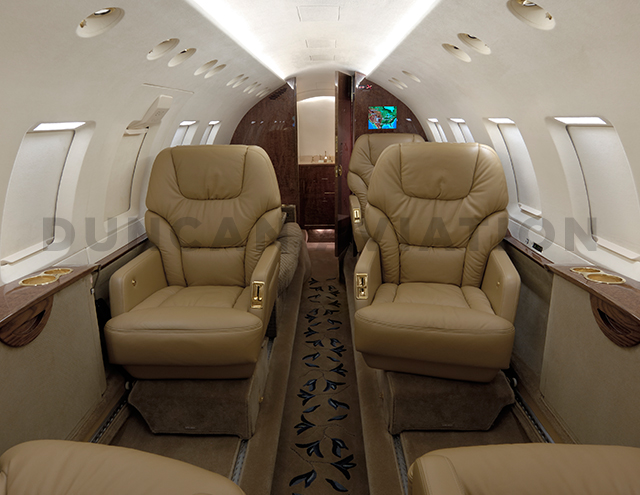 Hawker 800 updated interior with warm brown and gold accents