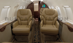 Hawker 800 updated interior with warm brown and gold accents