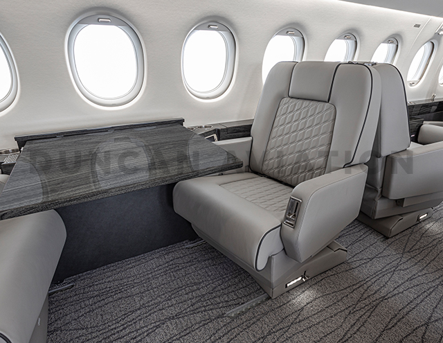 Club seat and conference table in updated Falcon 2000