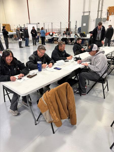 Duncan Aviation team members work on collaborative art project in clean hangar