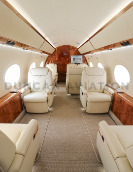 Refurbished interior of Gulfstream 650 with cream leather and warm wood