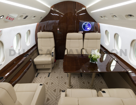 Falcon 2000 with refurbished interior in shades of rich brown wood and light tan leather