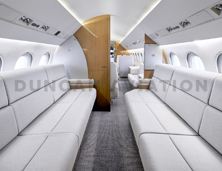 Matching divans inside refurbished interior of Falcon 900